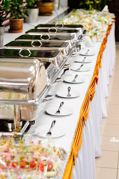 chafing dishes at table ready for wedding catering